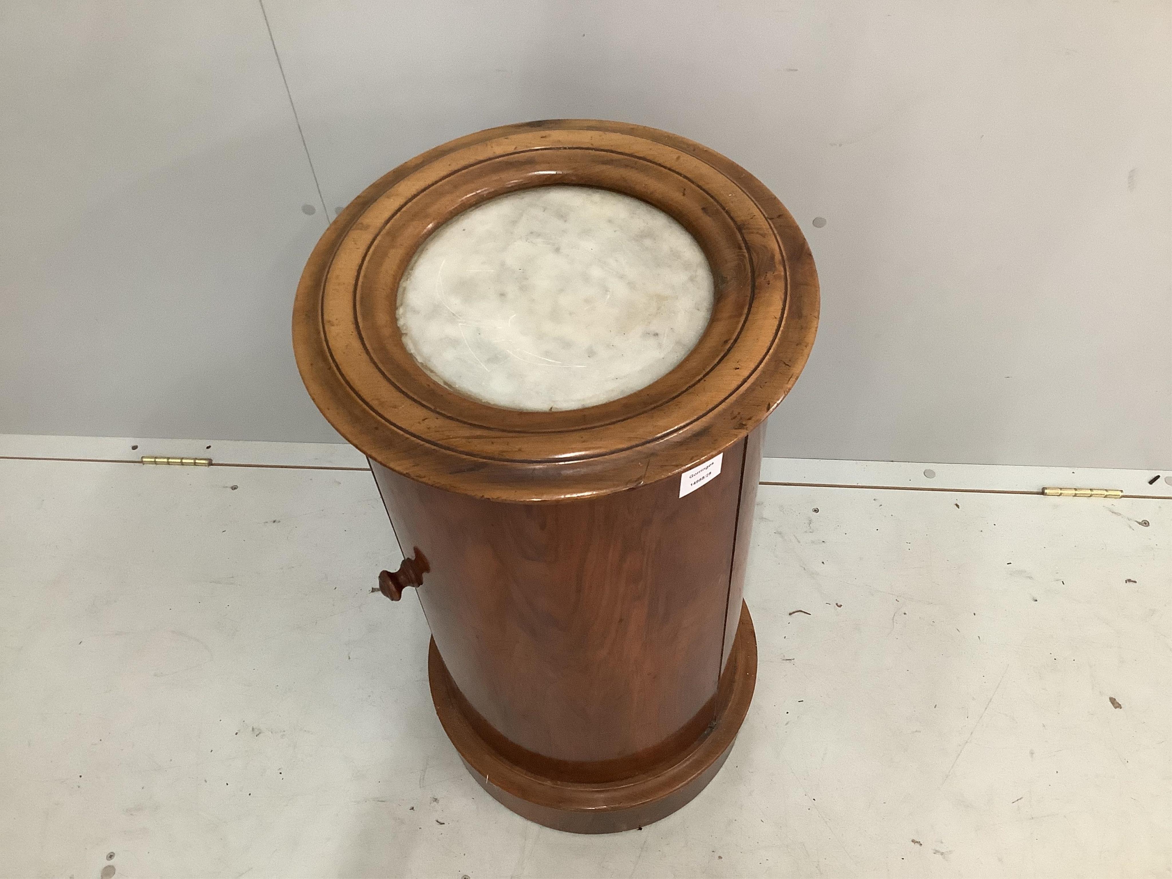 A Victorian walnut cylindrical bedside cabinet with a white marble inset top, diameter 40cm, height 75cm. Condition - fair